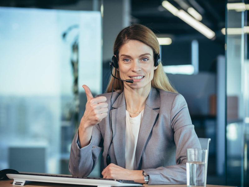 portrait-of-woman-with-headset-call-center-employee-smiling-and-happy-talking.jpg